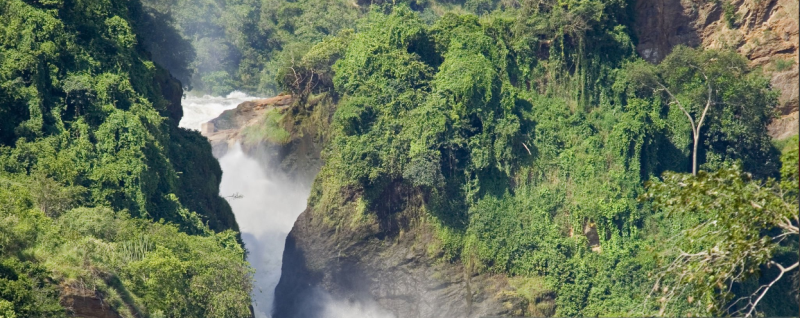 A breathtaking view of Murchison Falls with the Nile River cascading over the rocky cliffs.