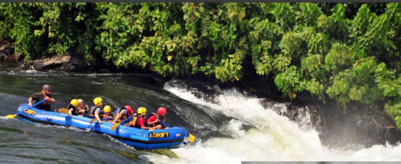 Adventurers enjoying thrilling white water rafting on the Nile River in Jinja, Uganda.